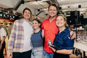Diverse business professionals collaborating in Work.Life flexible workspace showing creative studios, consultants and recruitment agencies working together in modern coworking environment